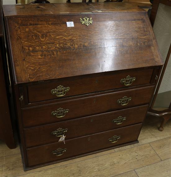 A George III oak bureau, 3ft 1in.